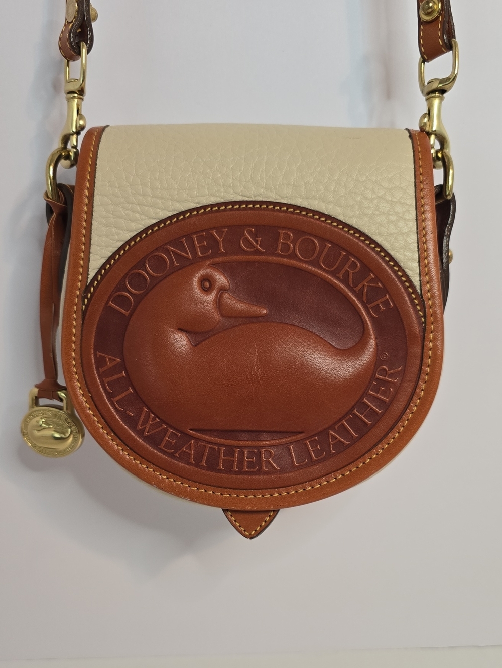 Dooney & Bourke Tan and Cream All-Weather Leather Logo Crossbody